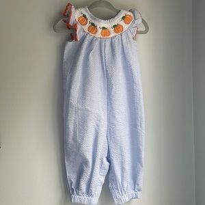 Lil Cactus blue and white seersucker jumper with smocked pumpkins. Size 6-12 m